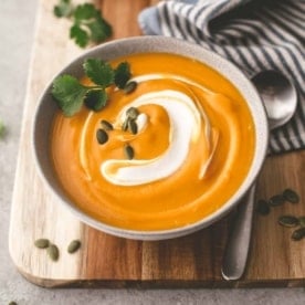 butternut squash soup in a white bowl