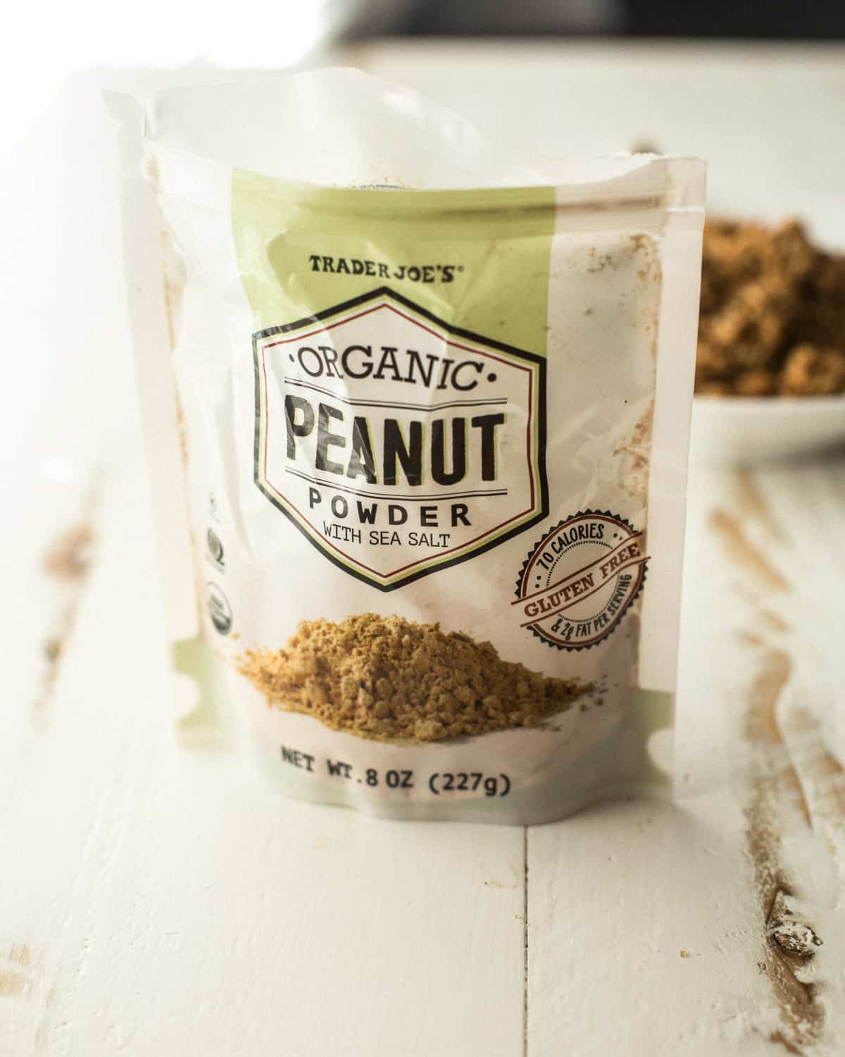 a bag of peanut powder on a white countertop