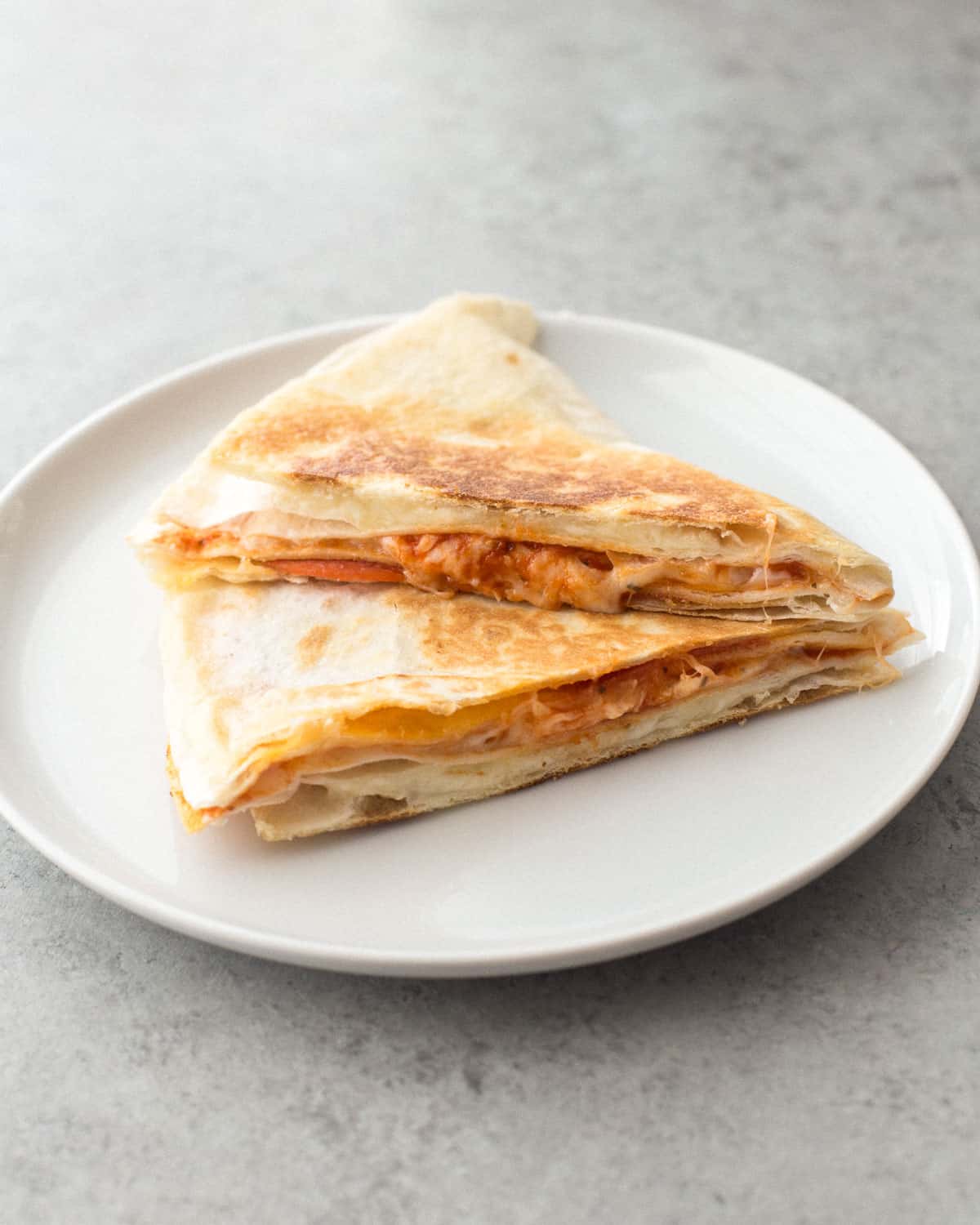 side shot of pizza tortilla quesadilla