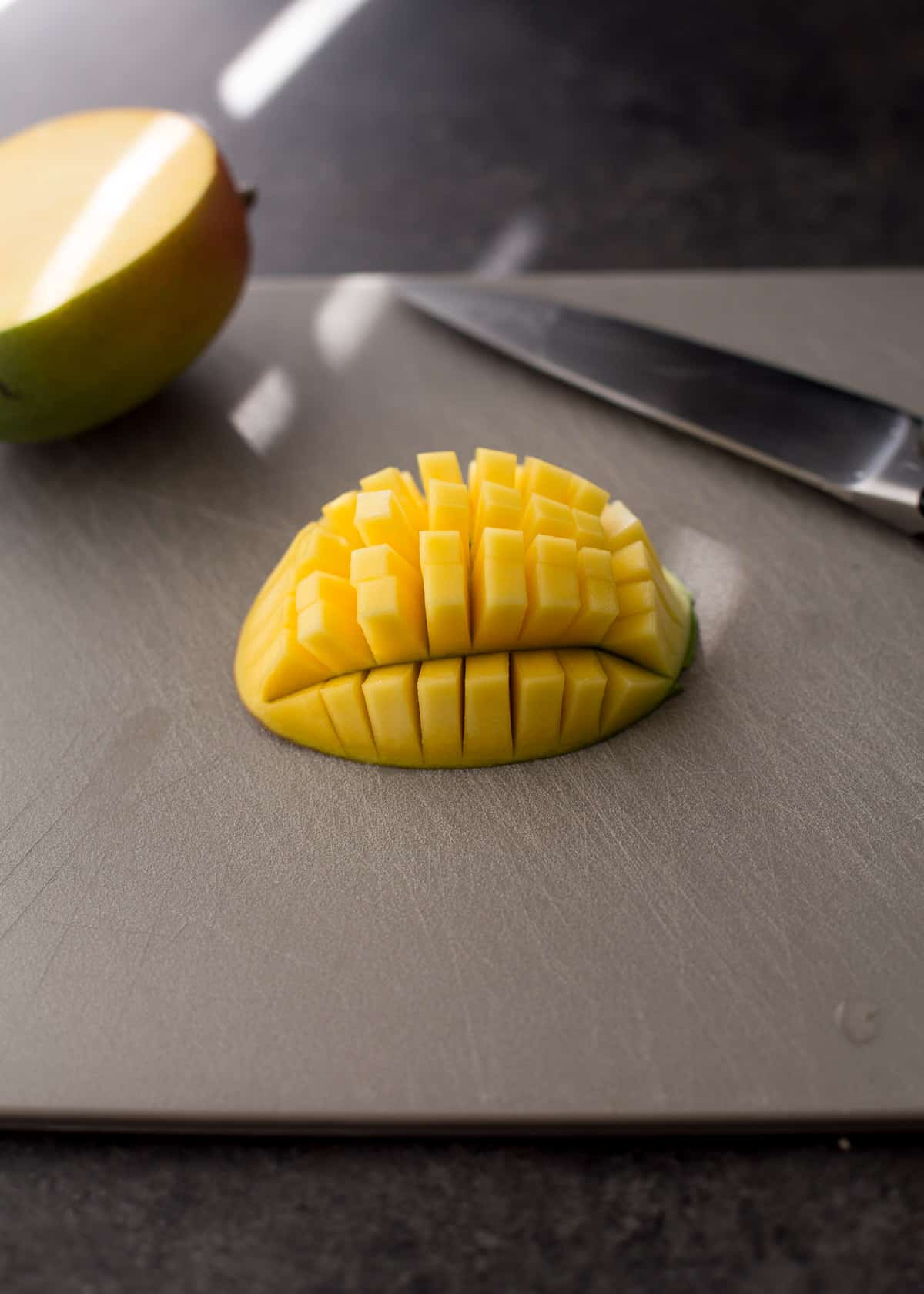 sliced mango on a cutting board