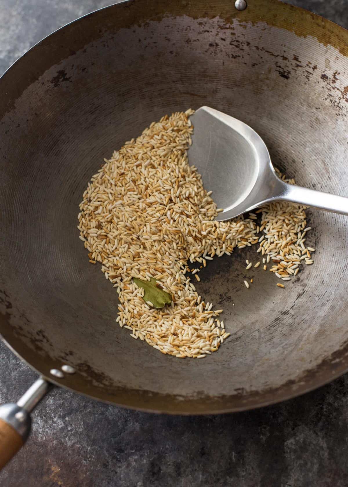 overhead image of toasting rice powder in a wok