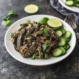 Thai beef salad on a white plate