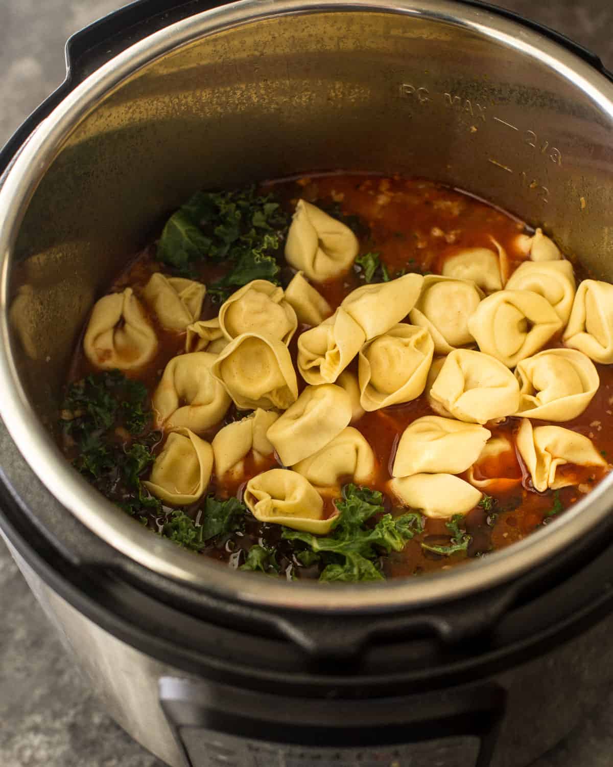tortellini, spinach and tomatoes in an instant pot