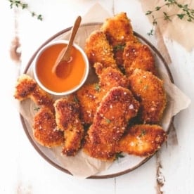 baked chicken with honey on a white plate