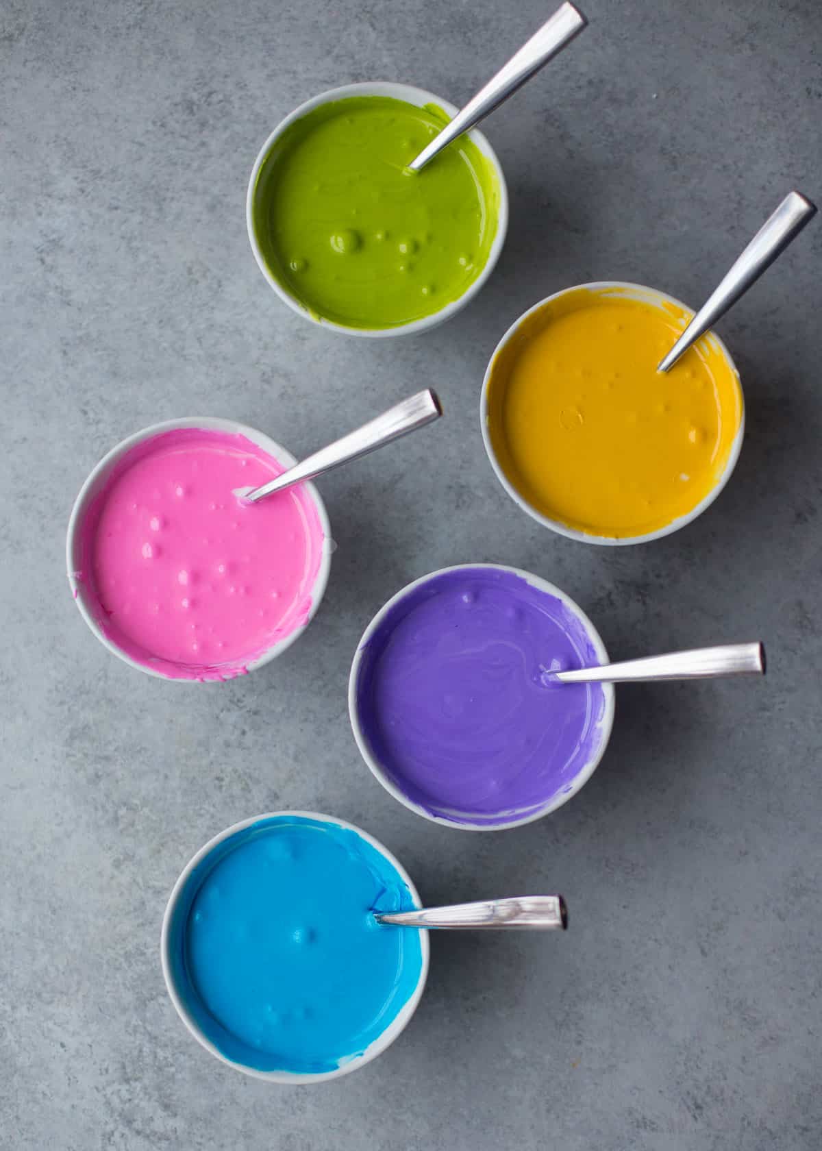 colored icing in cups
