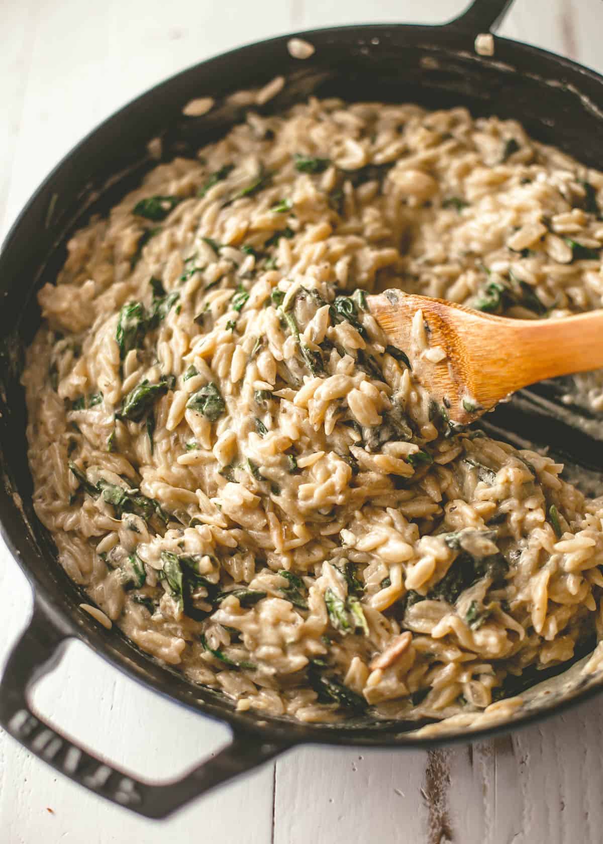 stirring orzo in a pan