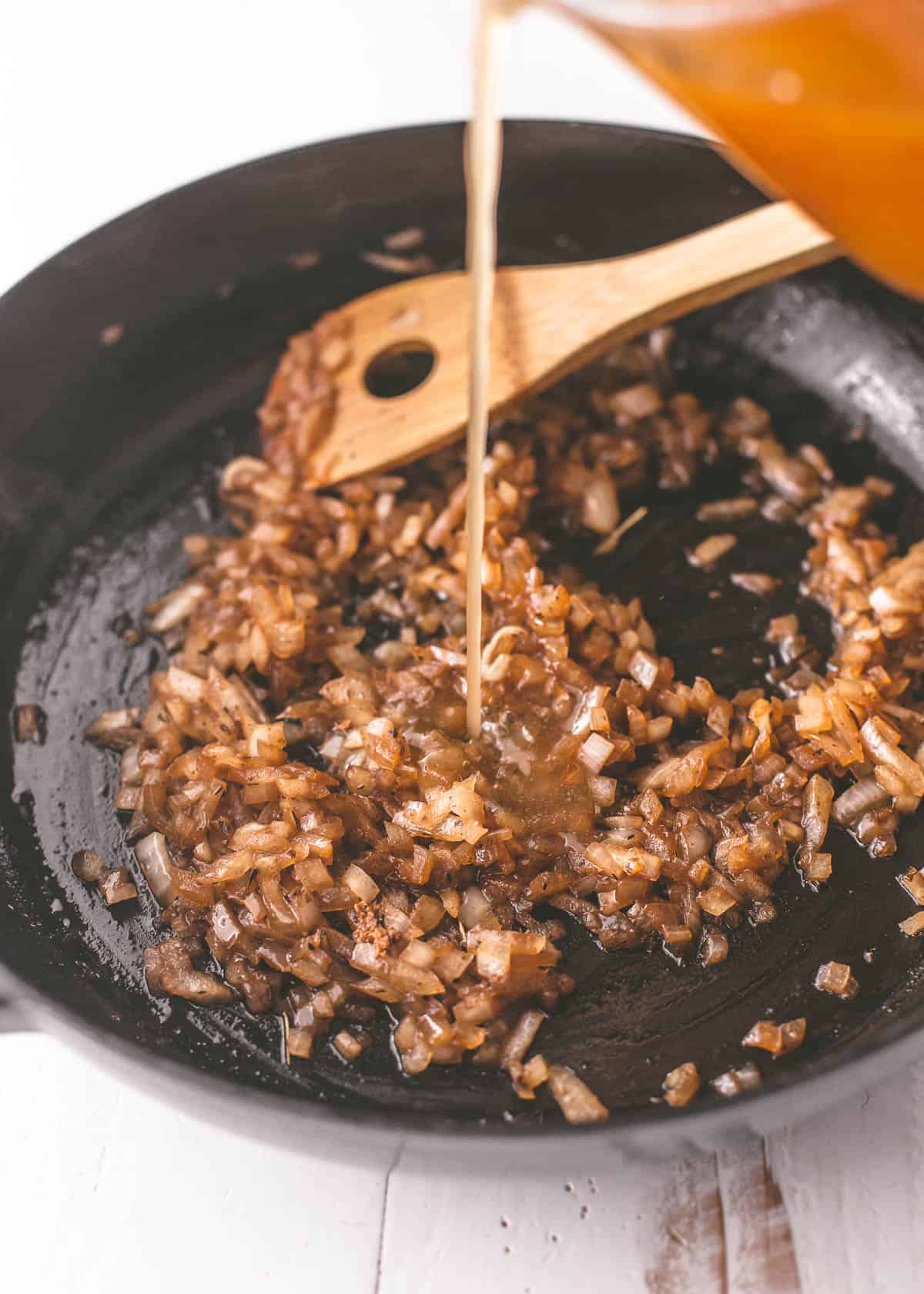 cooking onions in a cast iron pan