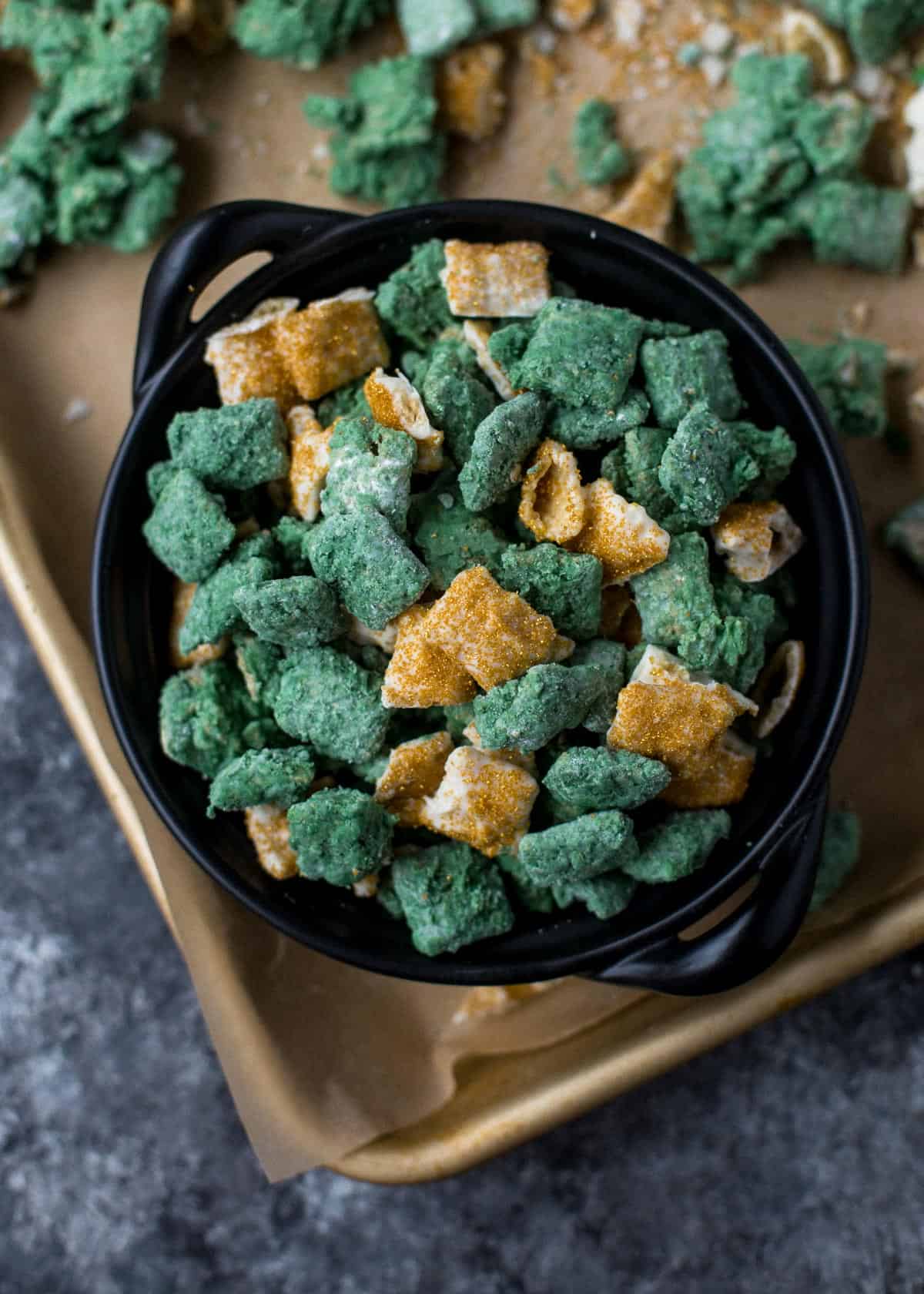 green and yellow puppy chow in a black bowl