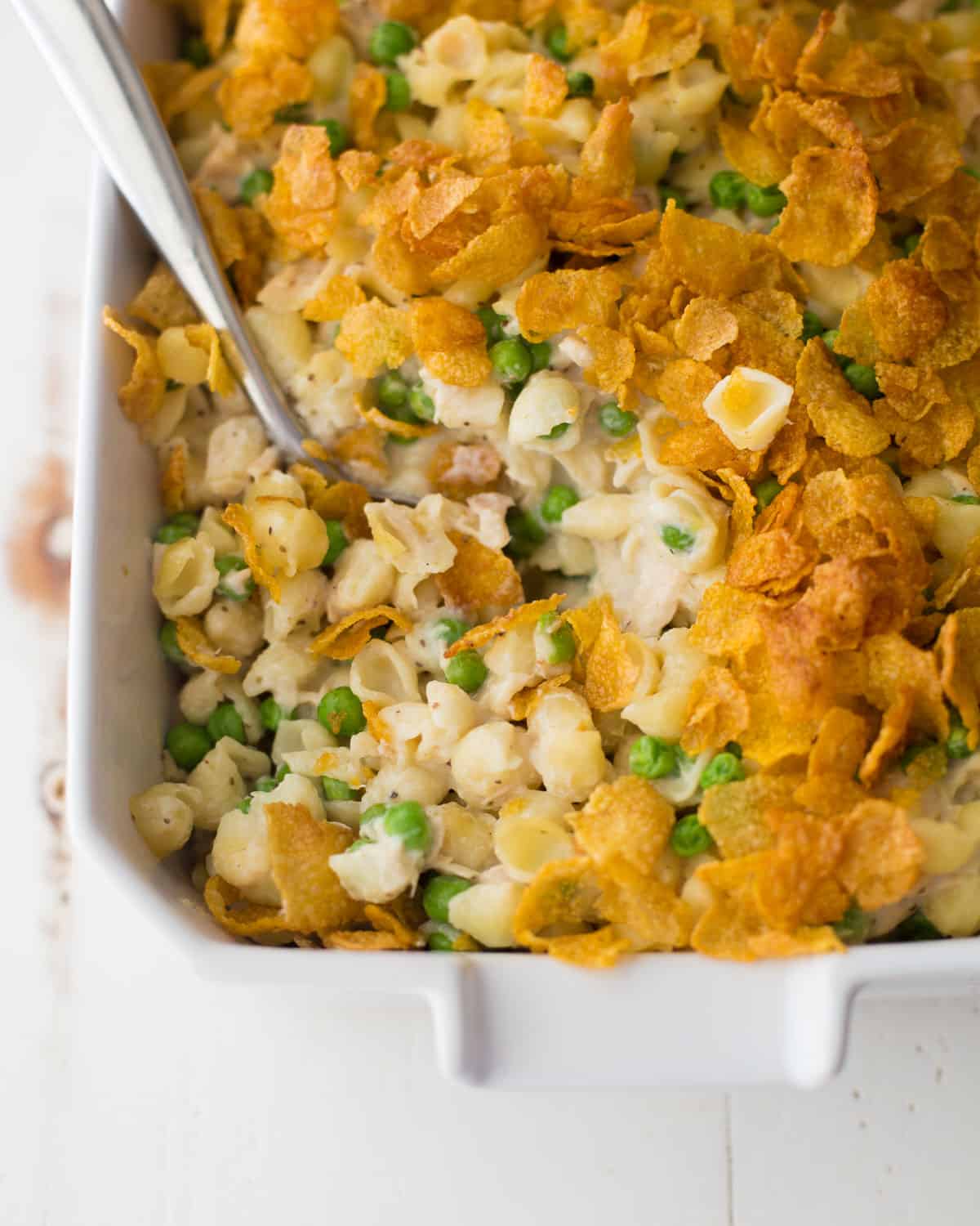 overhead image of a spoon in tuna casserole casserole