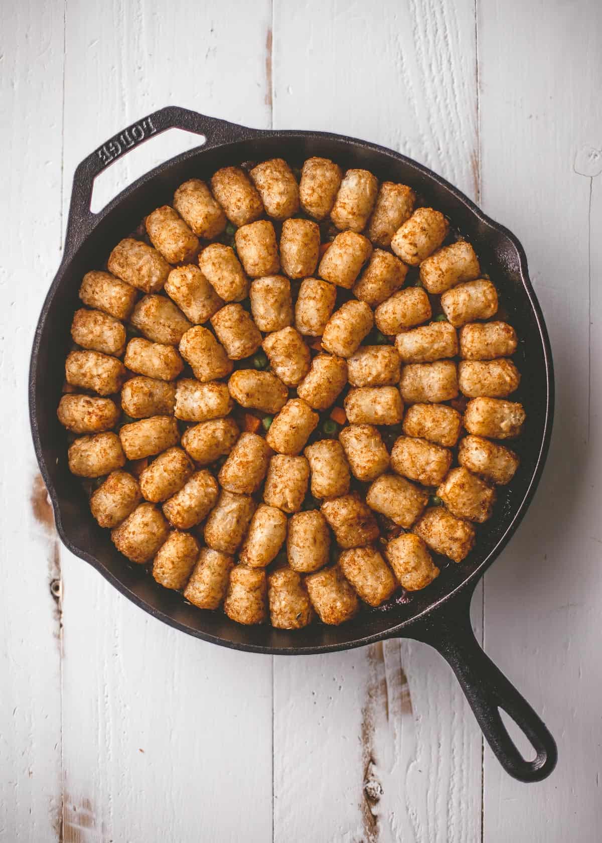 tater tot casserole in a cast iron skillet