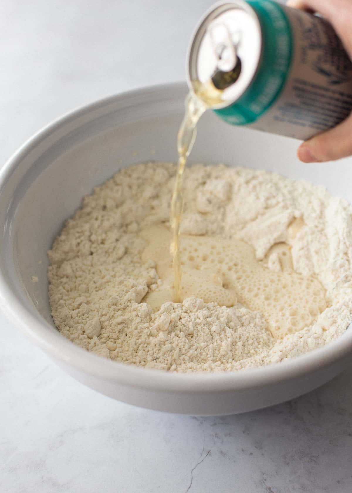 adding beer to bread mix