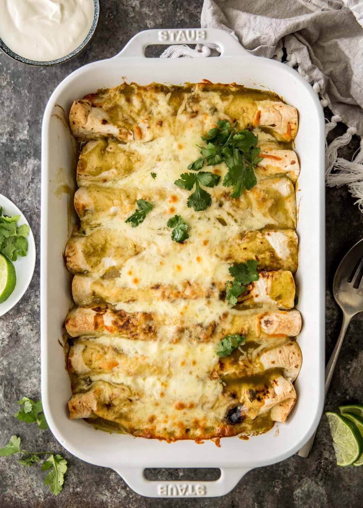 overhead image of enchiladas in a white baking dish