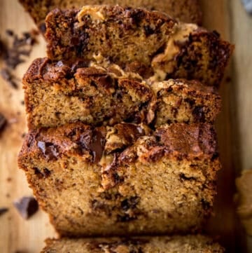 slices of chocolate peanut better banana bread on a wooden tray