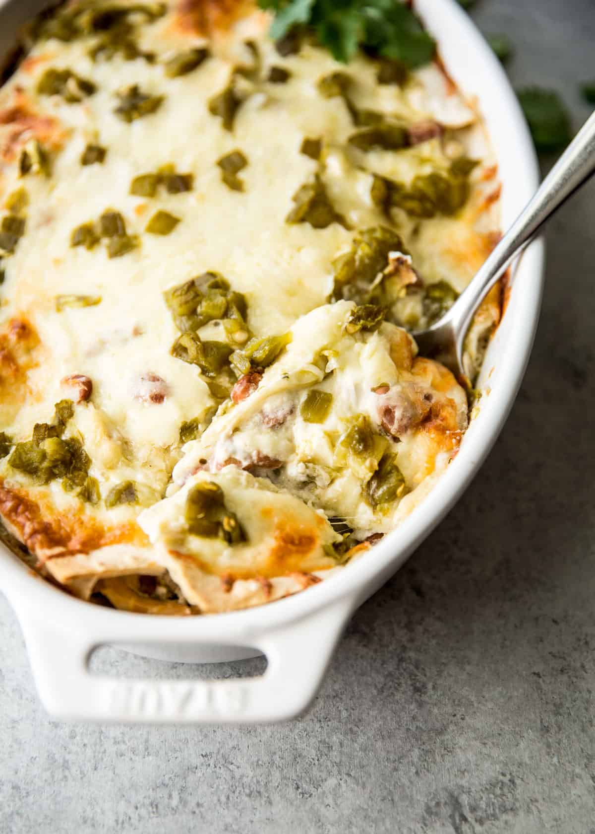 casserole in a white baking dish with a spoon