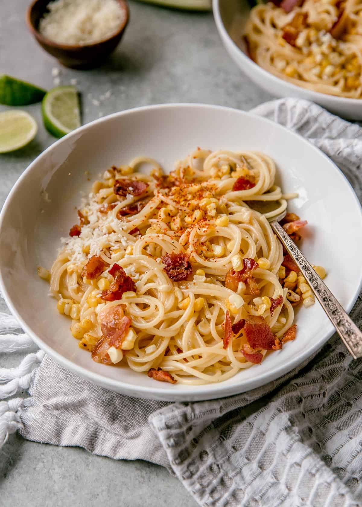 pasta and a spoon in a white bowl