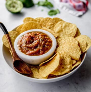 chips and salsa in white bowls