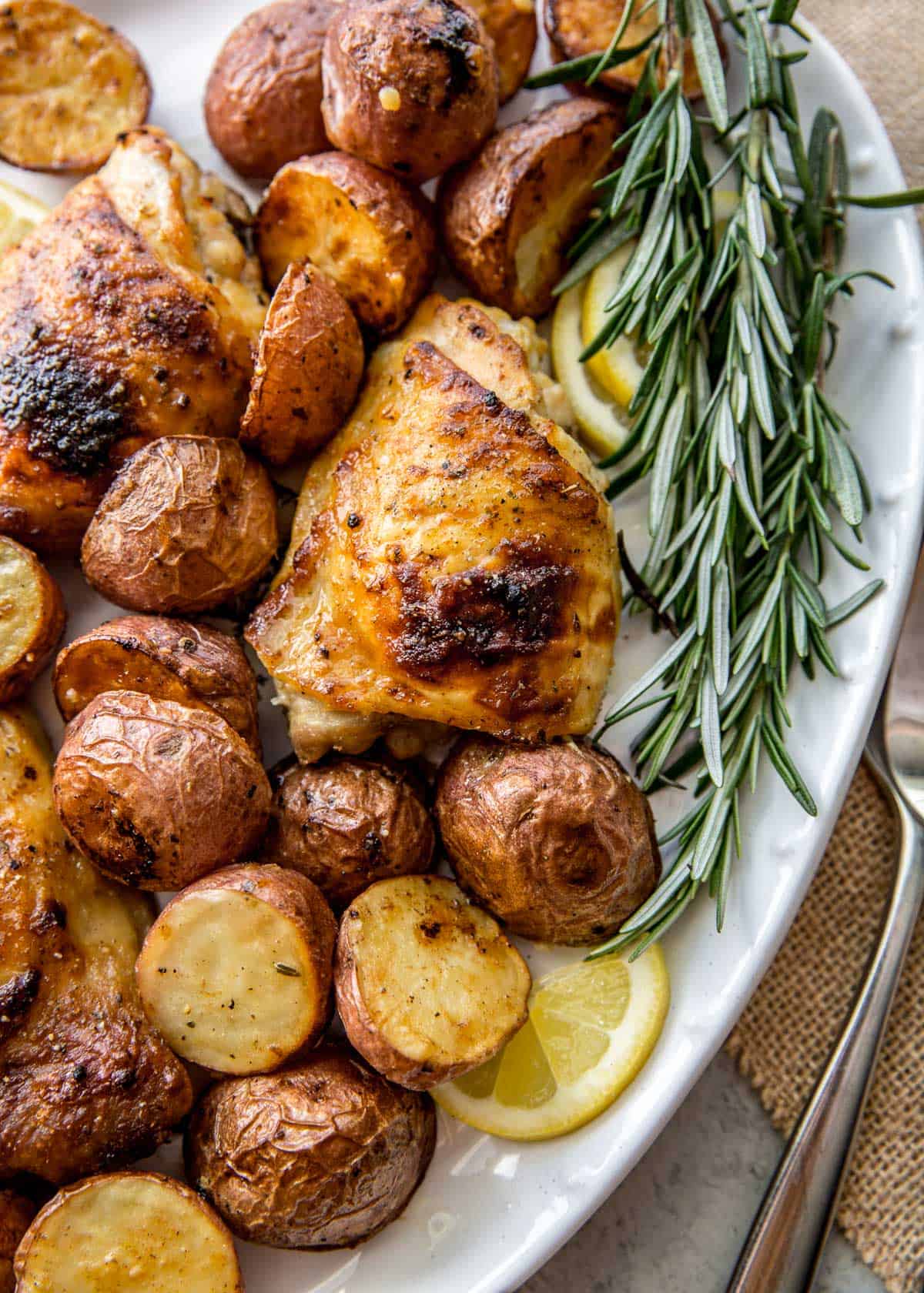 chicken and potatoes on a white plate