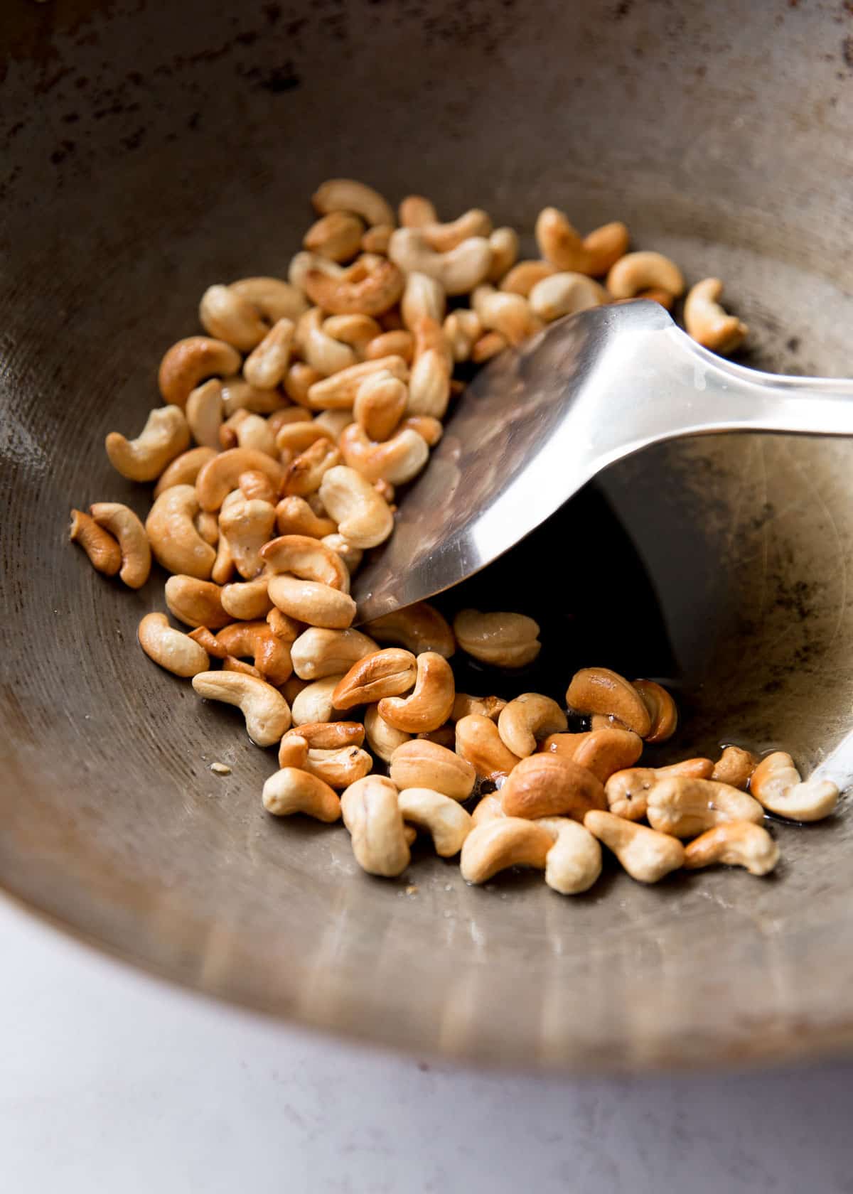 toasting cashews in a wok