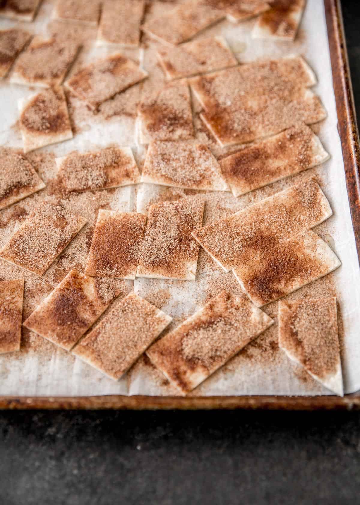 cinnamon sugar chips on a parchment lined sheet pan