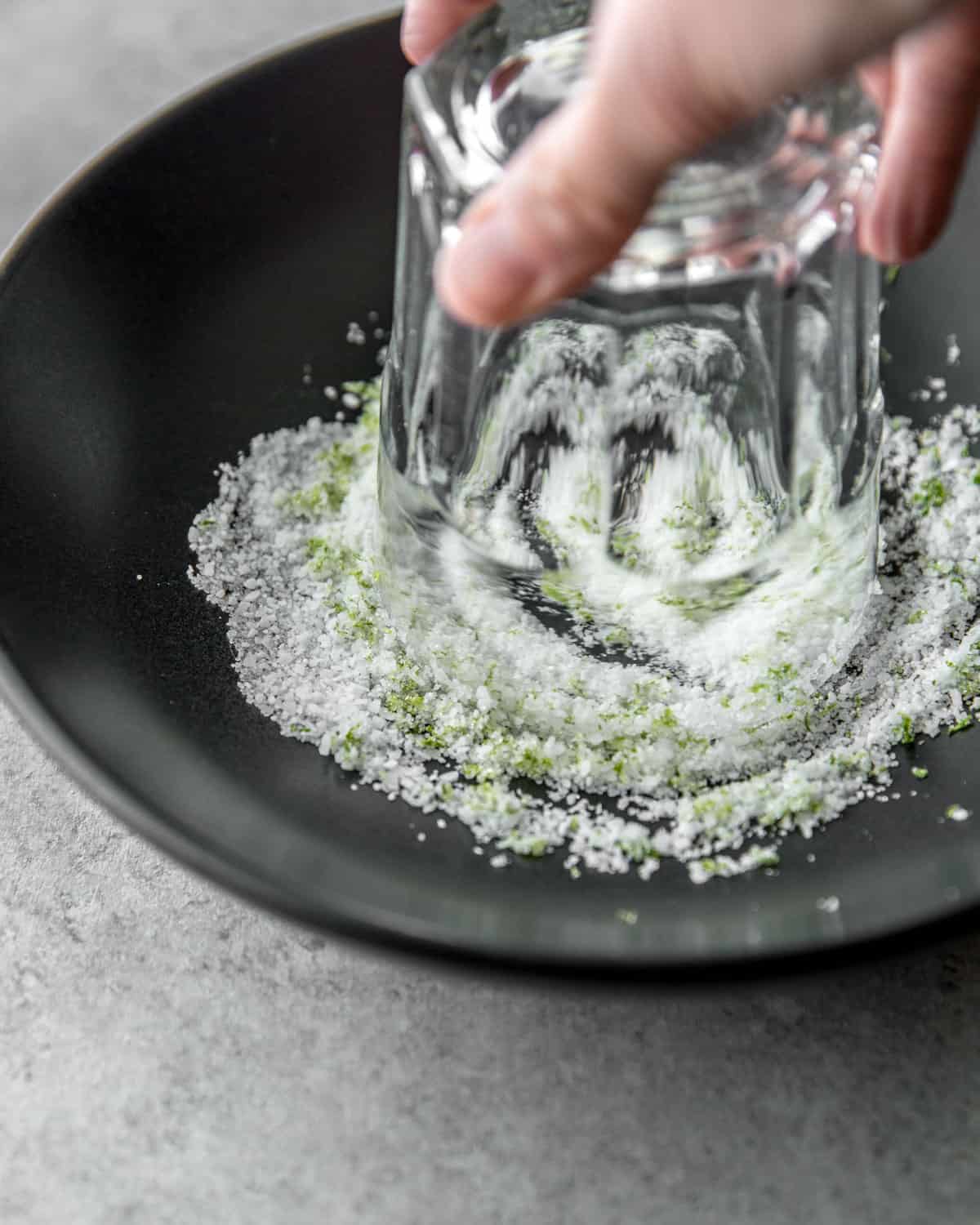 adding sugar and salt to the rim of a glass