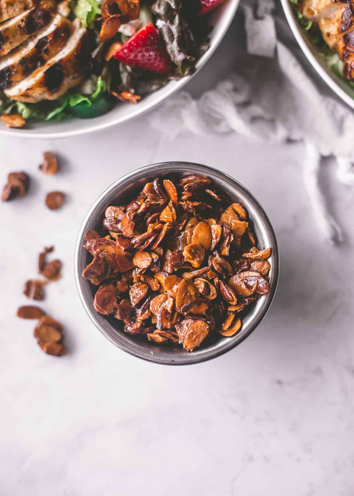 overhead image of candied almonds in a small bowl