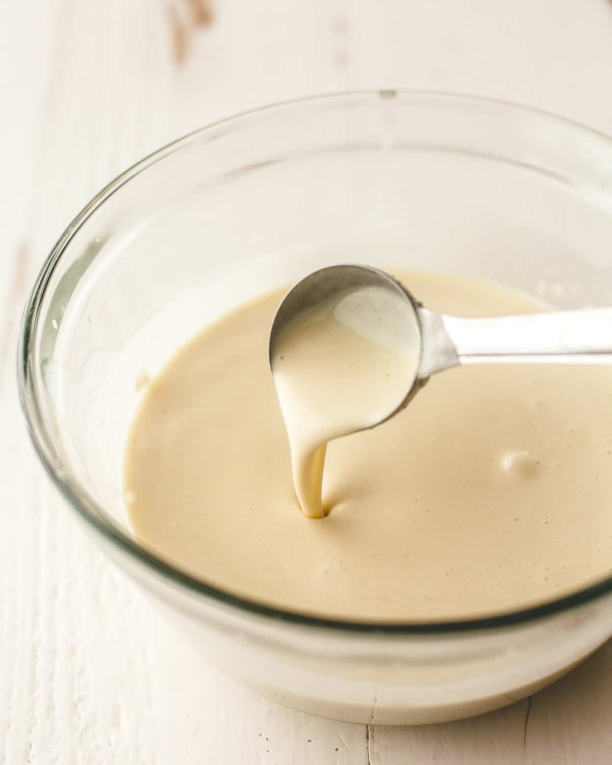 crepe batter in a clear glass bowl