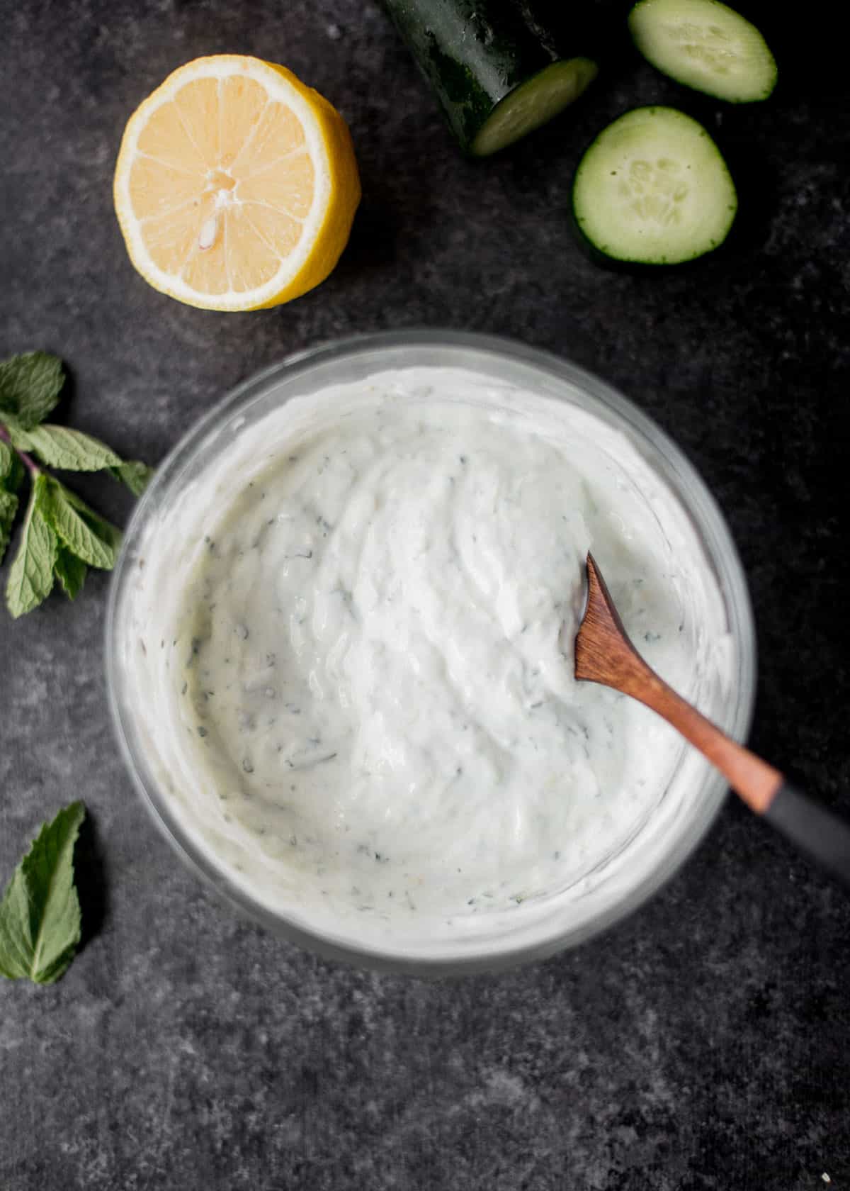 overhead image of tzatziki in a clear glass bowl