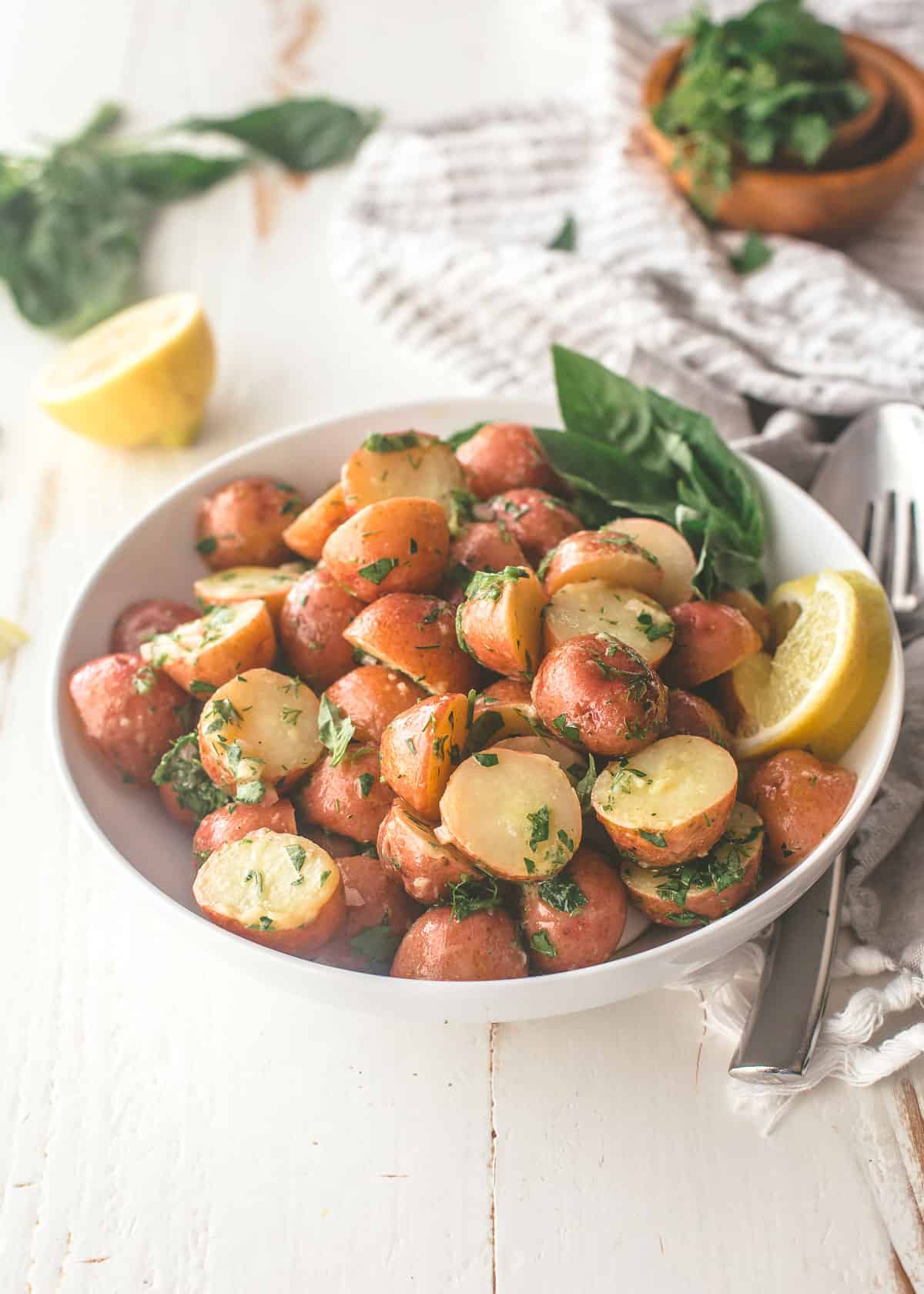 potatoes in a white bowl on a white table