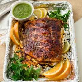 blackened salmon on sheet pan with citrus slices