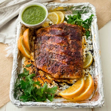 blackened salmon on sheet pan with citrus slices