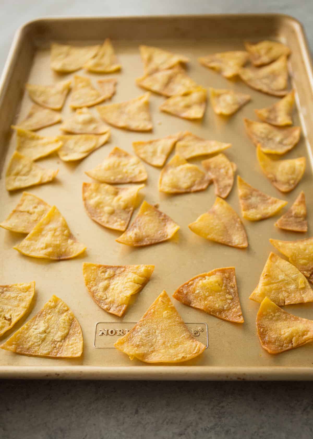 baking tortilla chips on a sheet pan