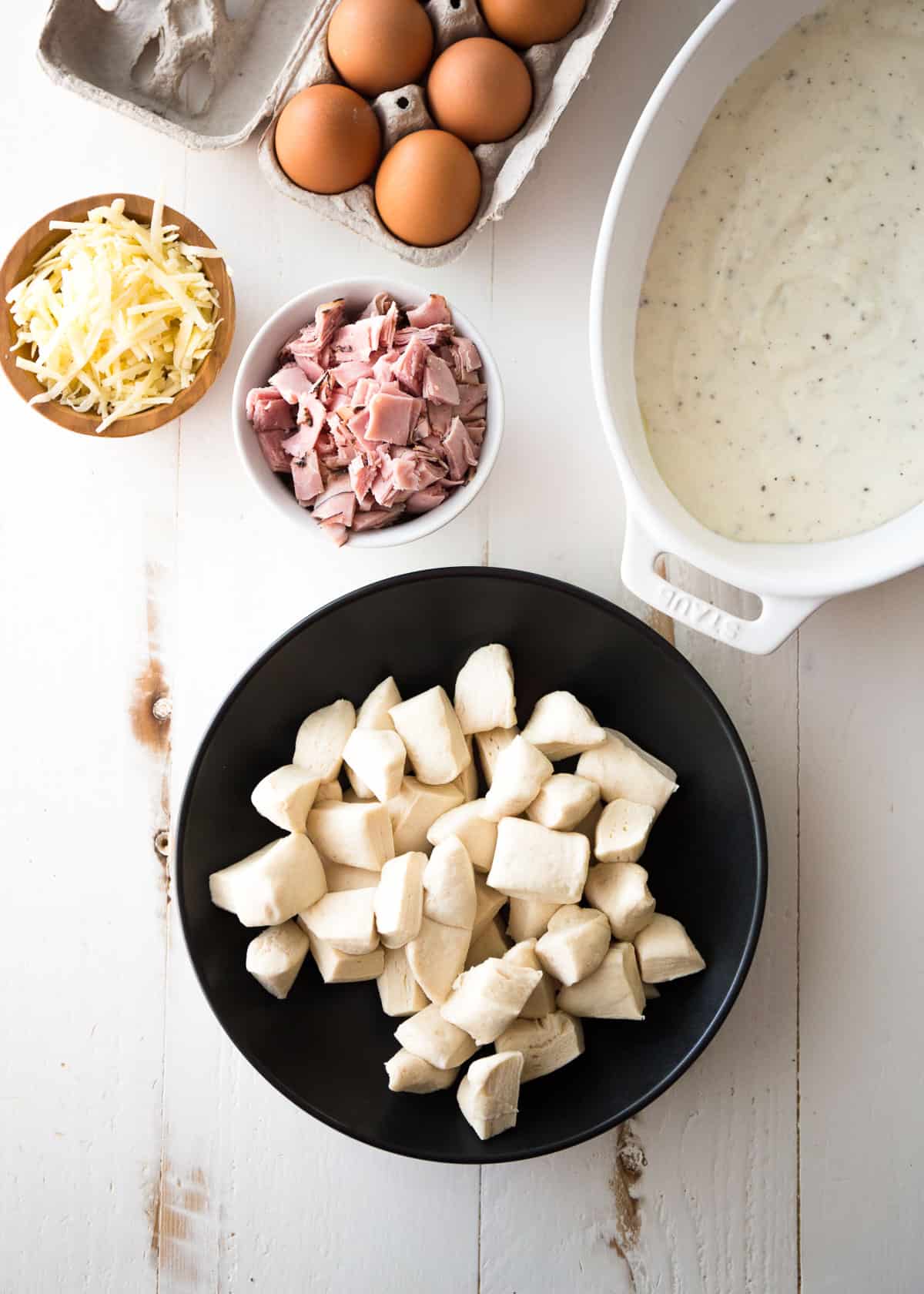 ingredients for croque madam on a white table