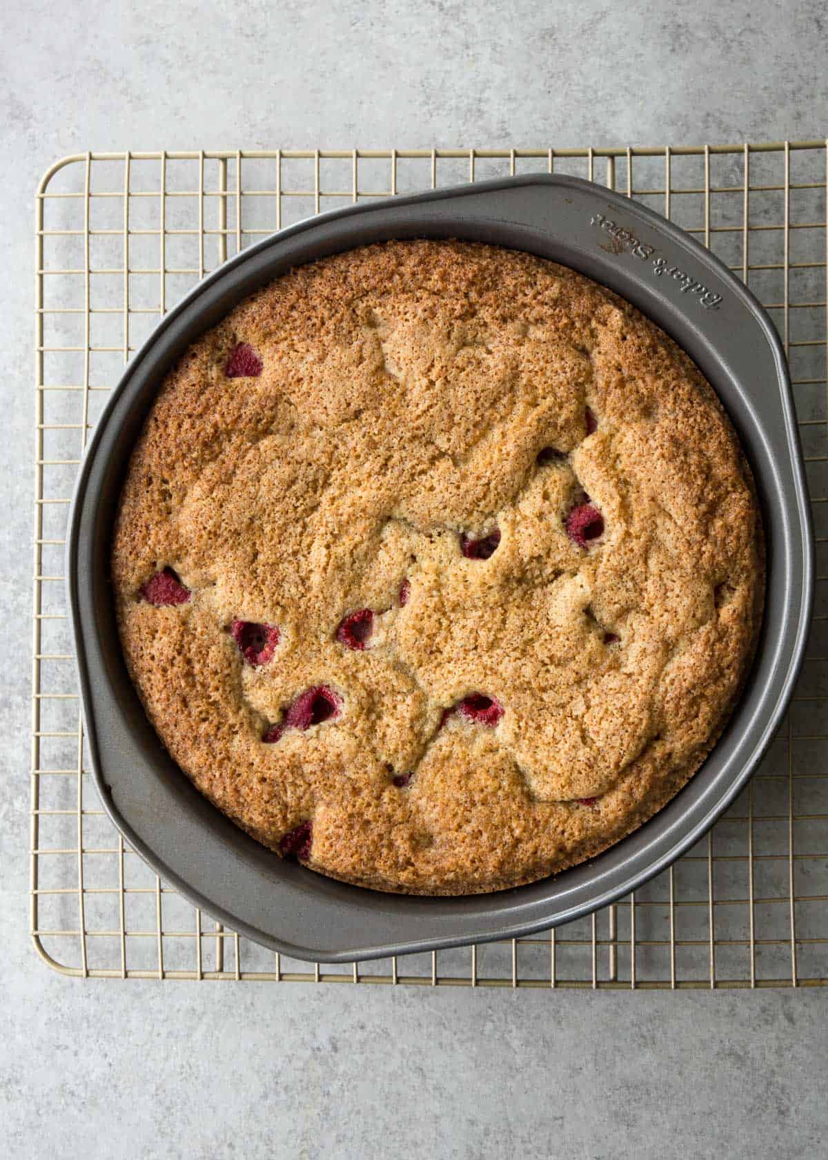 raspberry snack cake in a round cake pan