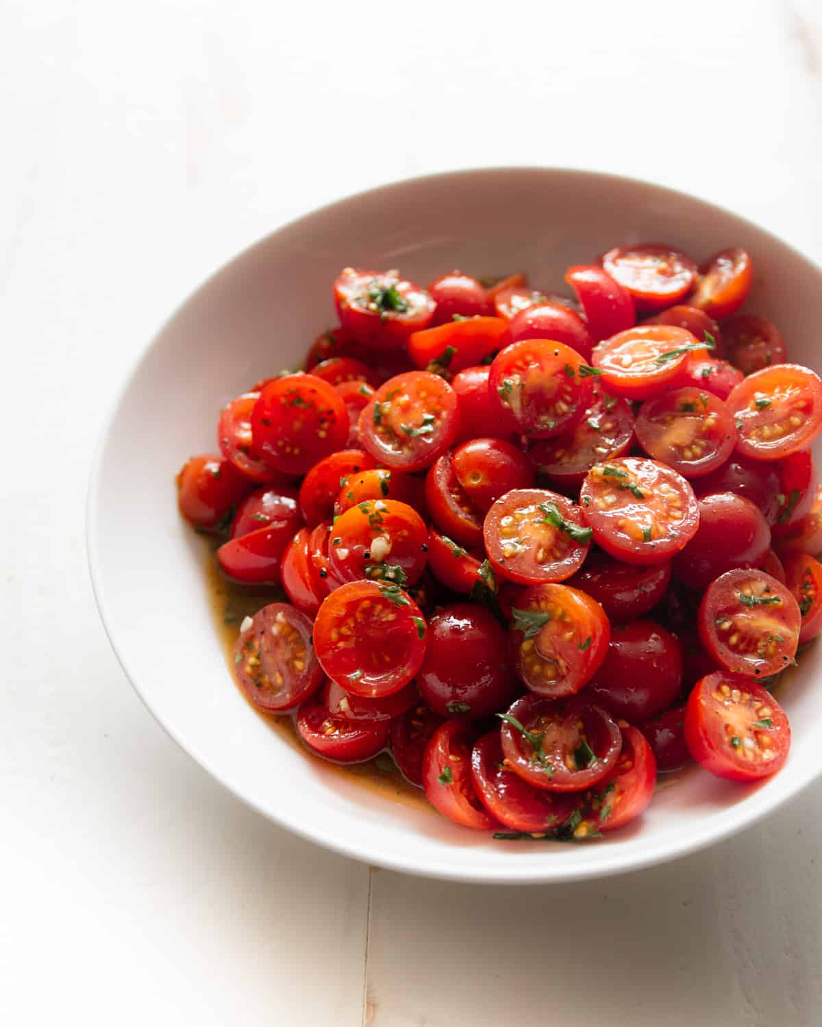 cherry tomatoes in a white bowl