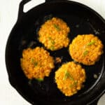 corn fritters in a cast iron skillet