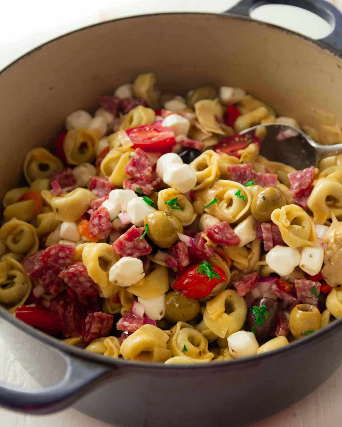 pasta salad in a blue dutch oven