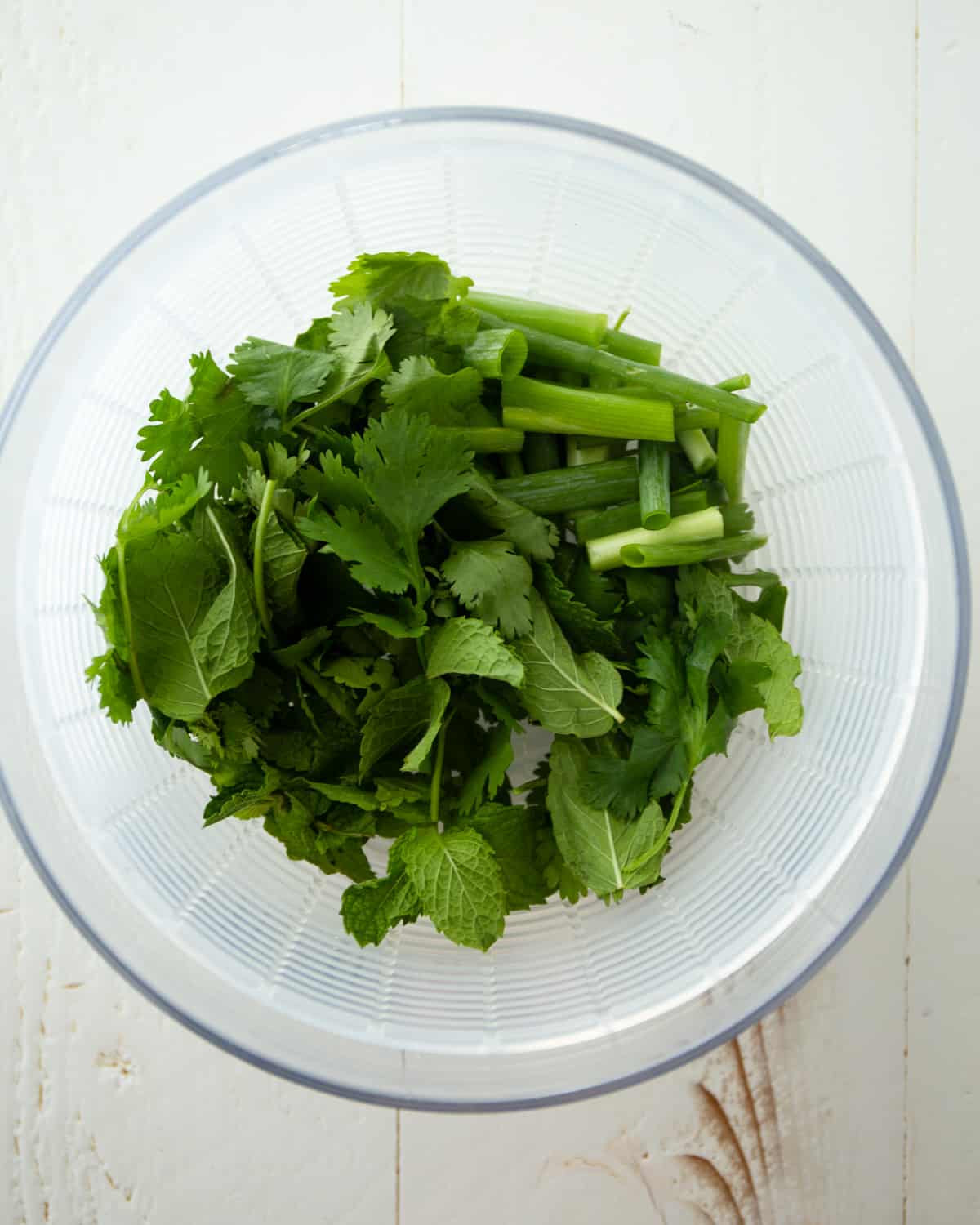 chopped herbs in a clear bowl