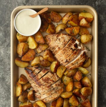 potatoes and chicken on a sheet pan