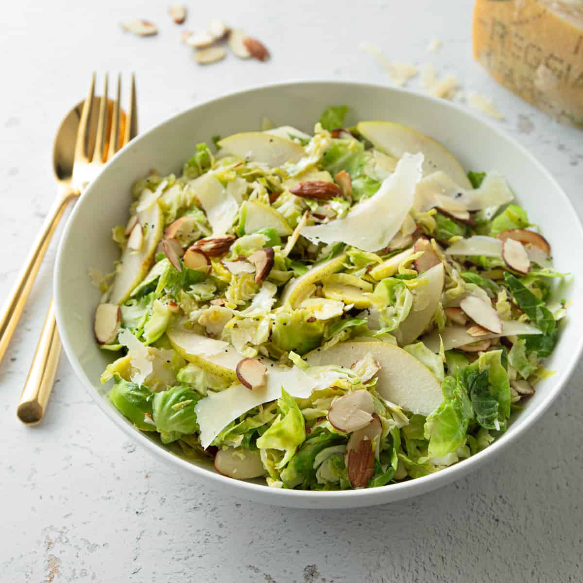 brussels sprouts salad in a white bowl