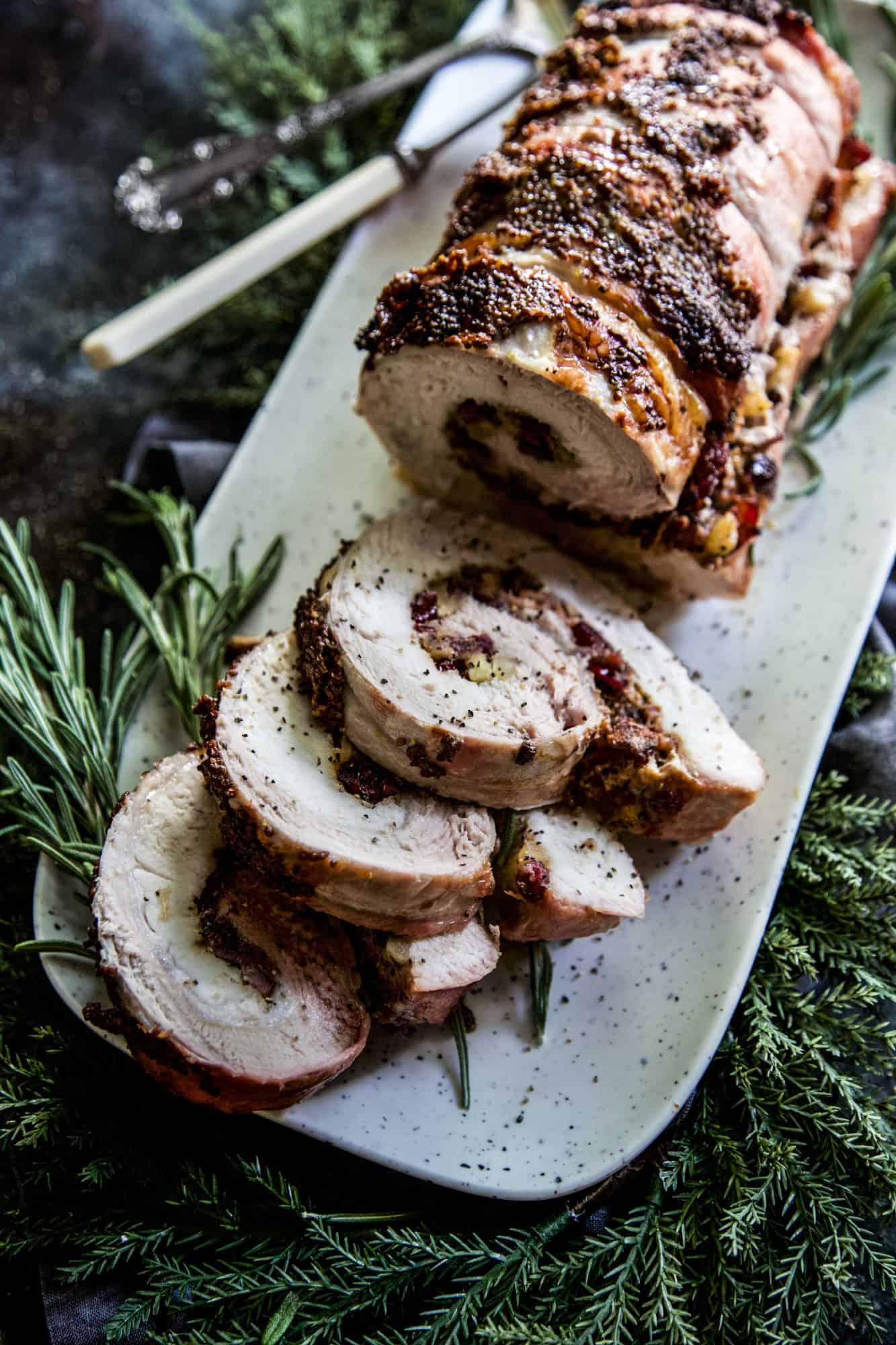 sliced pork tenderloin on a white tray