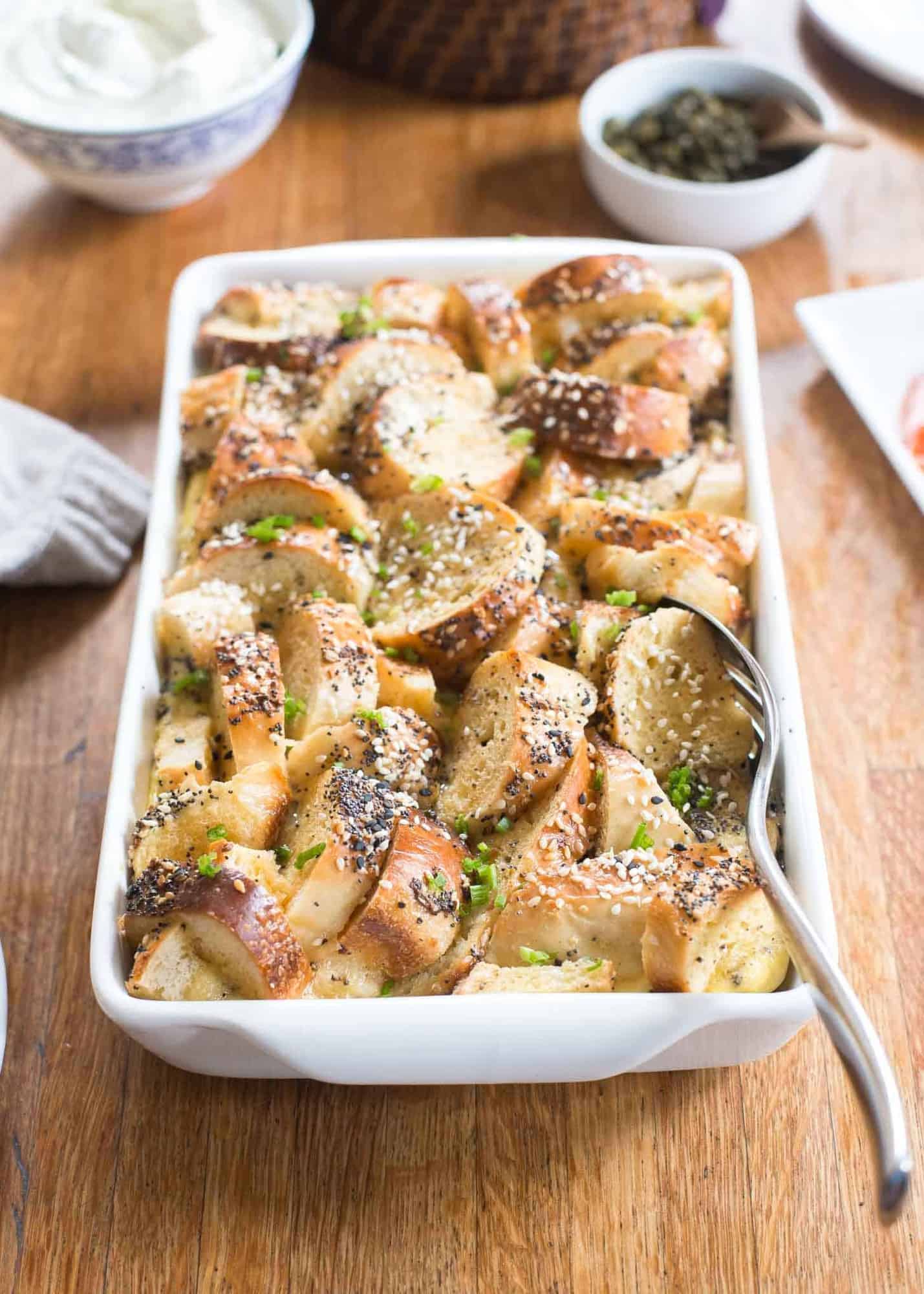 bagel and egg breakfast bake in a white baking dish