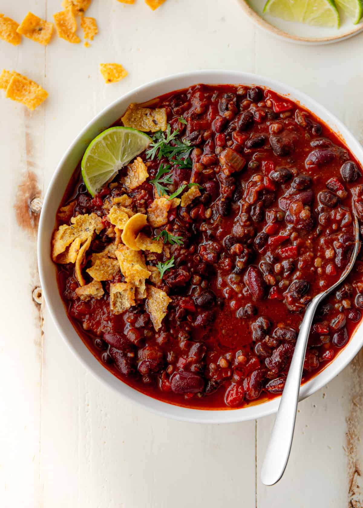 lentil and bean chili in a white bowl