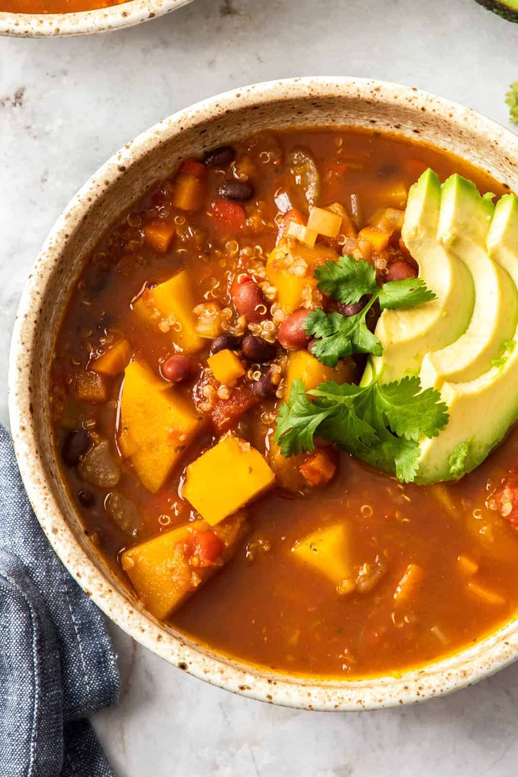 squash and bean chili in a white bowl