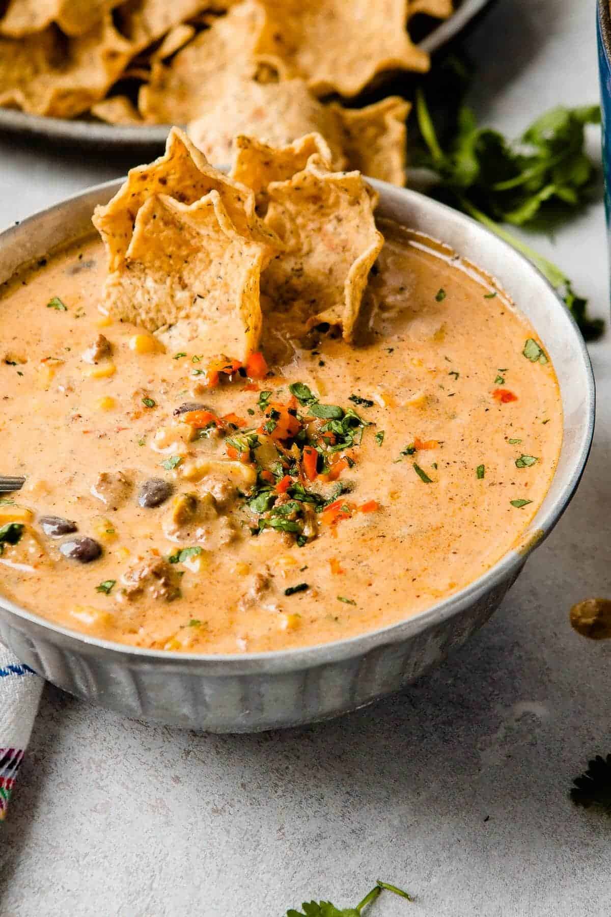 ground beef enchilada chili in a grey bowl