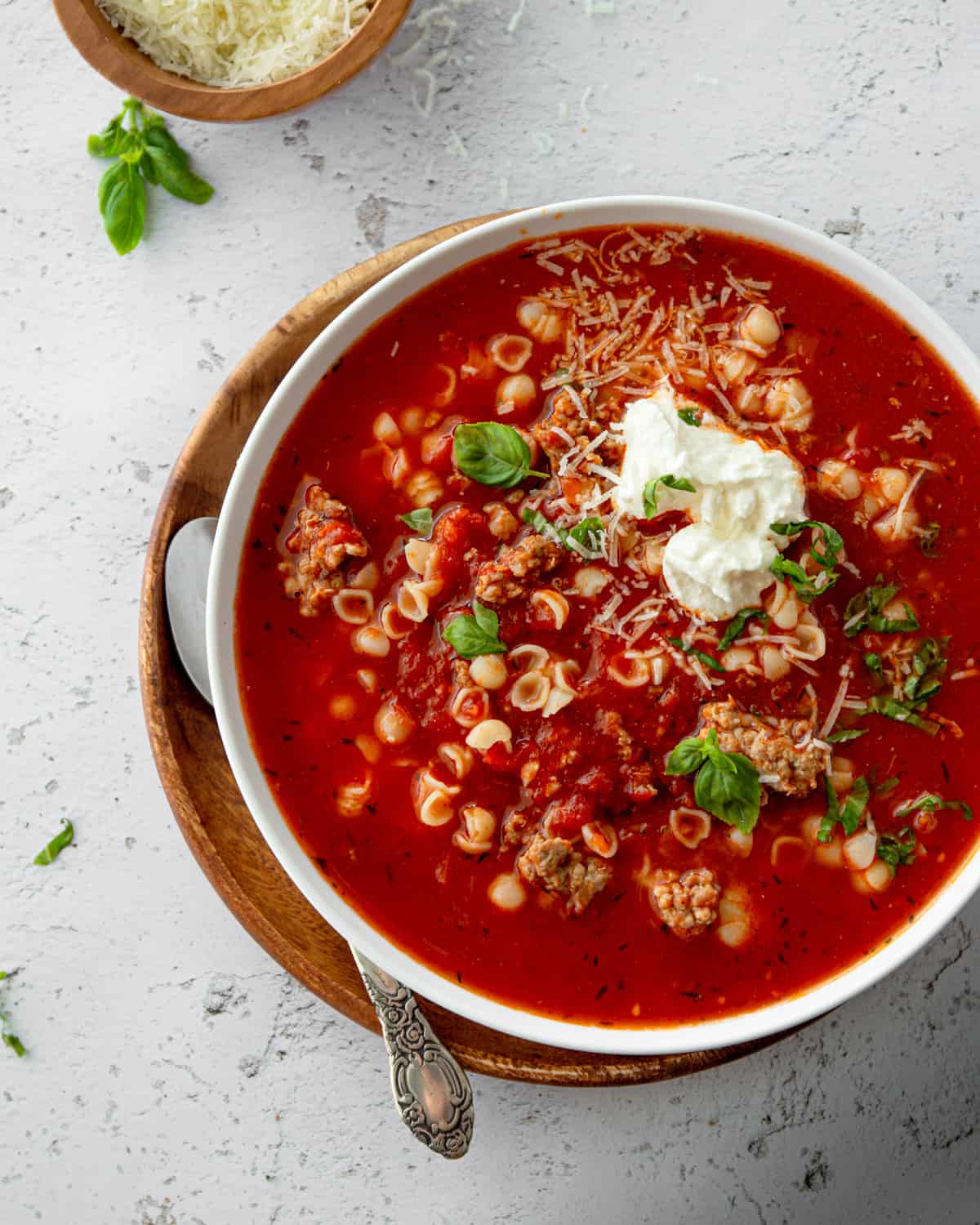 a bowl of tomato soup on a white countertop