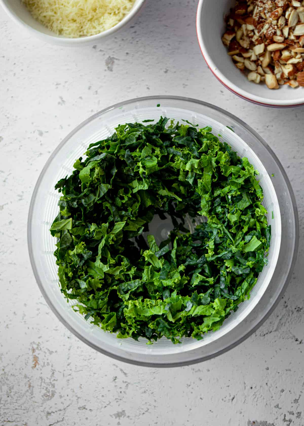 chopped kale in a salad spinner