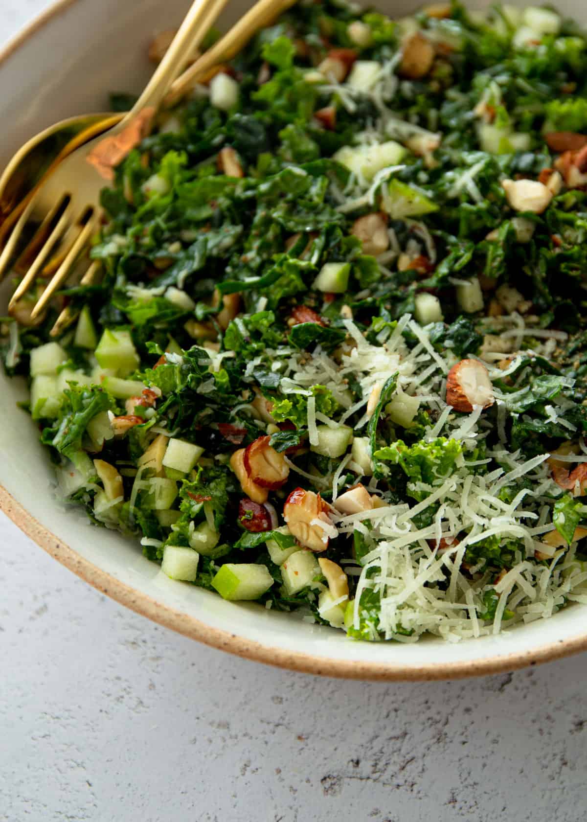 kale salad in a white bowl