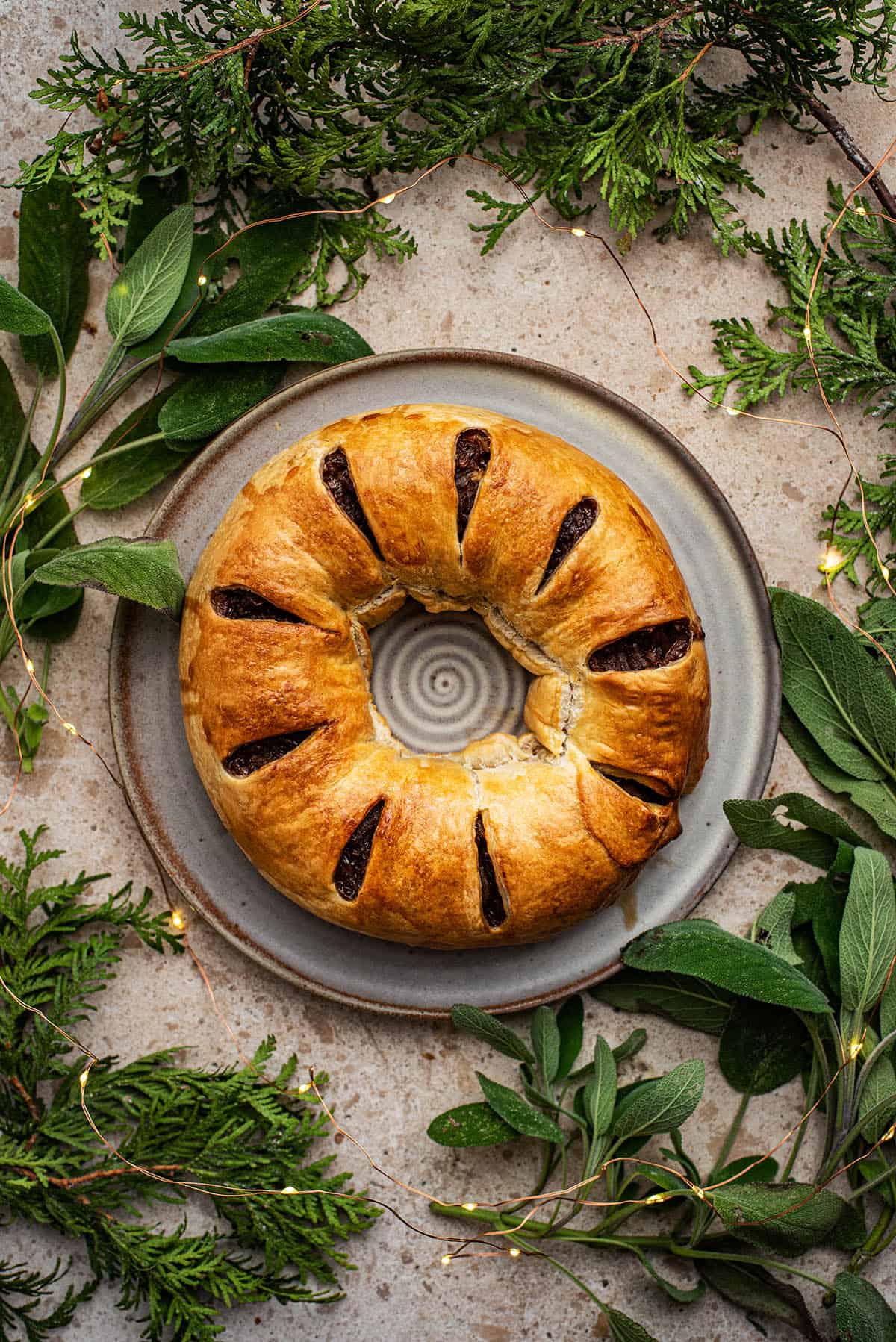 mushroom and onion wreath on a grey plate