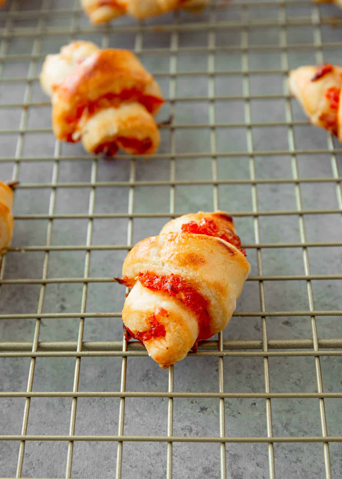 red pepper jelly rugelach on a wire rack