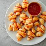 red pepper jelly rugelachs on a white plate